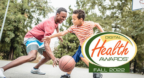 An older and younger brother in red play basketball while smiling, overlaid with the Digital Health Awards logo