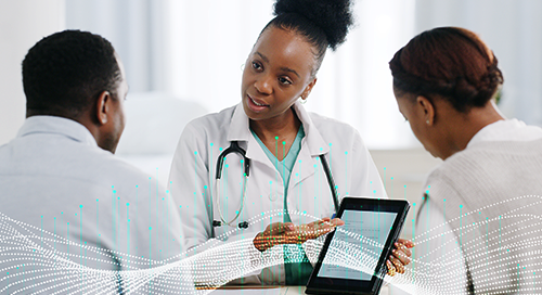 A doctor with a white lab coat and stethoscope holds a tablet device up for two individuals in white to read. There is digital art of a waveform across the bottom of the image.