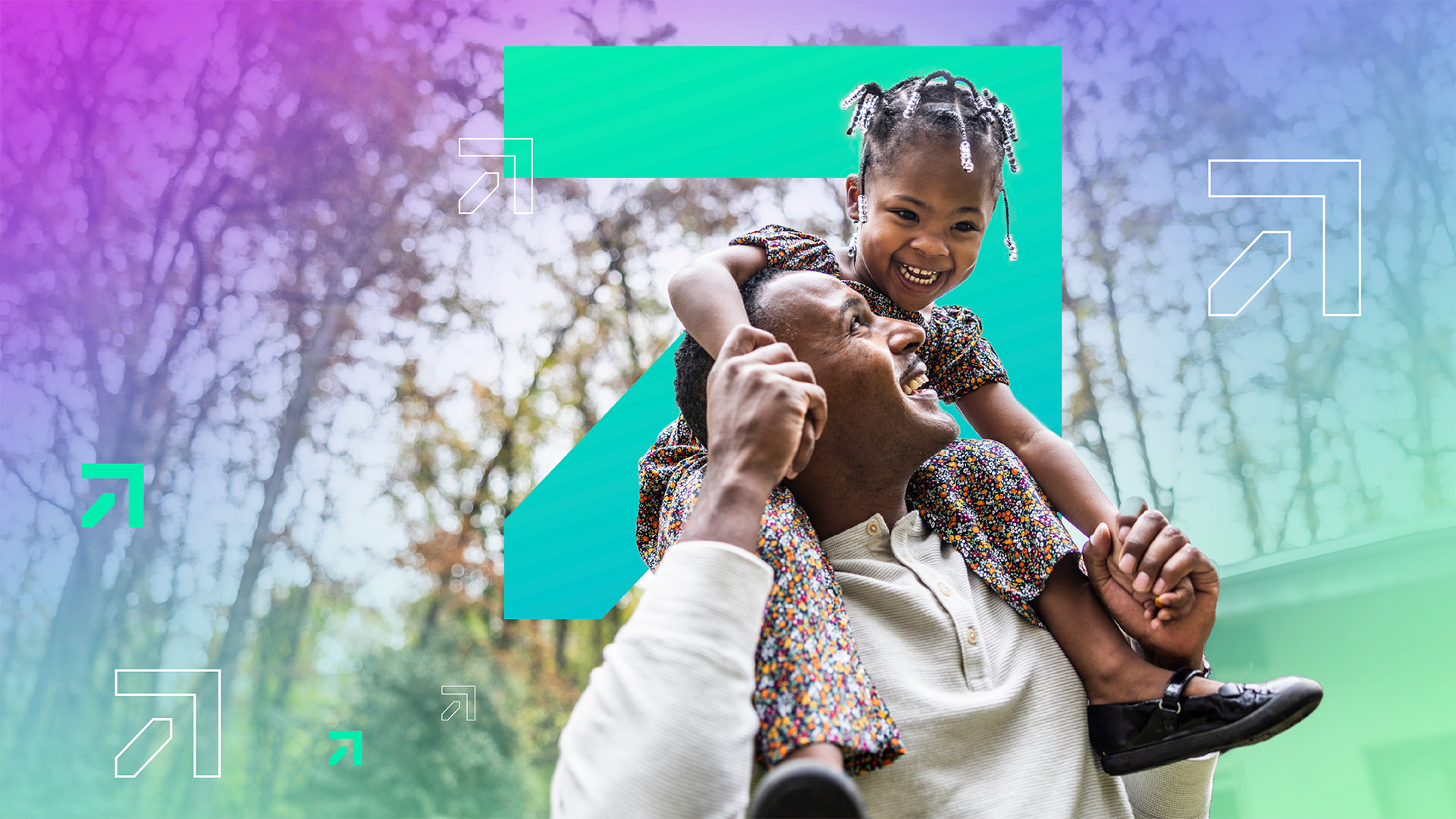 Close up of happy daughter on father’s shoulders as he holds her hands and looks up to her smiling.