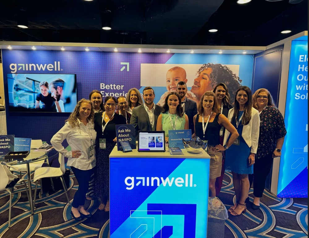 Gainwell employees at the booth at NAMPI 2024
